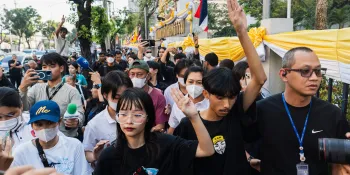 Tantawan Tuatulanon (left) and Nutanon Chaimahabut (right) flashing the three-finger 'Hunger Games' salute after being detained.