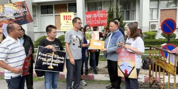 Activists submitting their petition to a court representative. (Photo from We, The People)