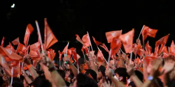 Move Forward Party's supporters waving orange flags with the party's logo during its final campaign event before the May 2023 general election, in which the party won the highest number of seats in the House of Representatives. (File photo)
