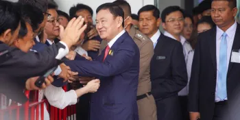 Thaksin Shinawatra greeting his supporters after landing at Don Muang Airport on 22 August 2023 (Photo by Kotcharak Kaewsurach)