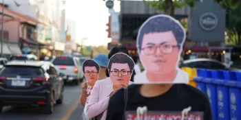 Protesters in Chiang Mai wore masks in the image of detained human rights lawyer Anon Nampa during a protest on 25 December demanding the release of political prisoners. (Photo by Pipob Udomittipong)