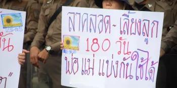 A sign at the 2023 International Women's day protest in front of Government House call for a 180-day paid parental leave which can be split between the parents.