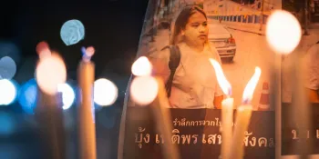 Candles lit in front of Netiporn's picture during a vigil marking 1 year and 3 months since her death. (Photo by Ginger Cat)
