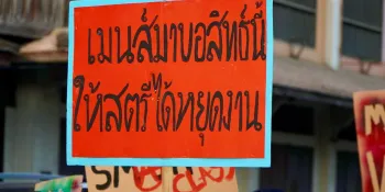 A banner during a Labour Day March in Chiang Mai calling for menstrual leave