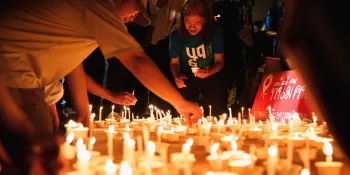 Candles were placed in front of the the 6 October Massacre Memorial Sculpture during the vigil at the end of the night.