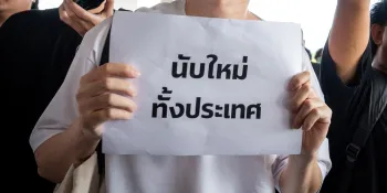 A protester holding a sign calling for a nationwide vote recount.