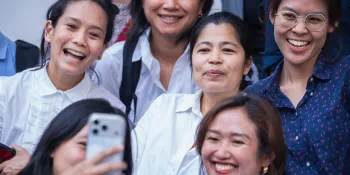 Pimsiri Petchnamrob with her supporters at the Criminal Court after being granted bail pending appeal. (Photo by Ginger Cat)